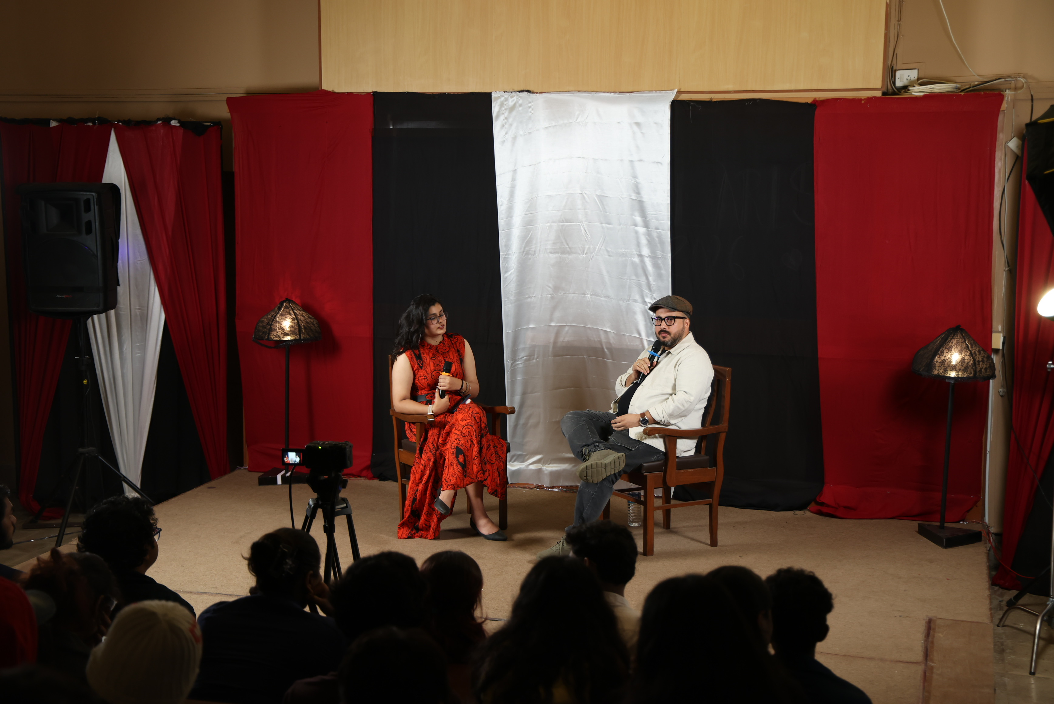 Actor and acting coach Hemant Kher speaking to students at Media Marvels, the Polaris 2026 pre-event hosted by Wilson College, with an engaged audience attending a session on acting, performance preparation, auditions and careers in the Indian entertainment industry.